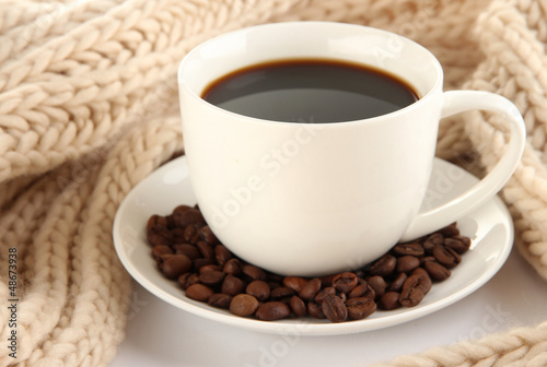 Photo: cup of coffee with scarf close-up cup of coffee with scarf close-up