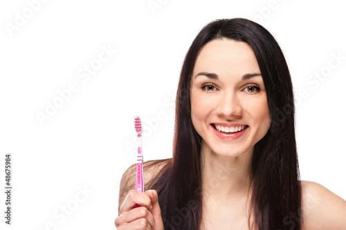 Photo: Portrait of brunette smiling woman with toothbrush Portrait of brunette smiling woman with toothbrush