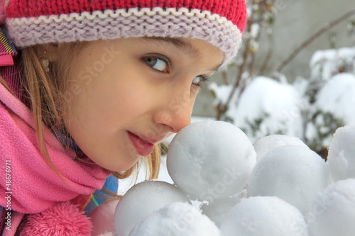 Photo: Girl with snowballs Girl with snowballs