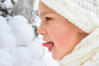 Photo: Girl with snowballs Girl with snowballs