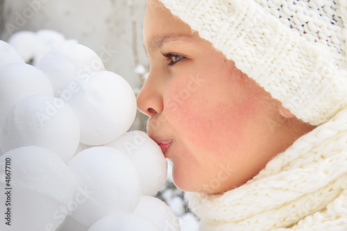 Photo: Girl kissing snowballs Girl kissing snowballs
