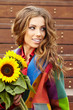 Fashion woman with sunflower at outdoor.