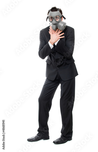 Photo: Choking business man with gas mask, isolated on white Choking business man with gas mask, isolated on white