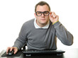 Photo: Man using computer at desk Man using computer at desk