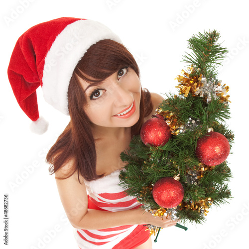 Photo: Santa woman with christmas tree. Wide angle Santa woman with christmas tree. Wide angle