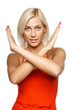 Young woman making stop gesture over white background