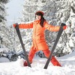 Happy girl with ski in the winter landscape