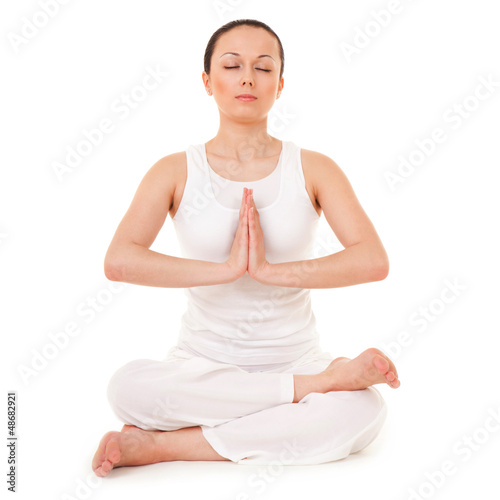 Photo: Young woman doing yoga exercise Young woman doing yoga exercise