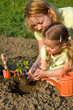 Foto: Woman and little girl in the garden Woman and little girl in the garden