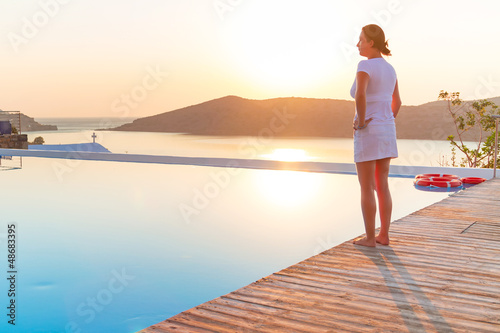 Photo: Meditation at sunrise over idyllic coast of Greece Meditation at sunrise over idyllic coast of Greece