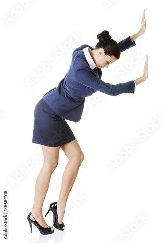 Photo: Attractive businesswoman pushing something Attractive businesswoman pushing something