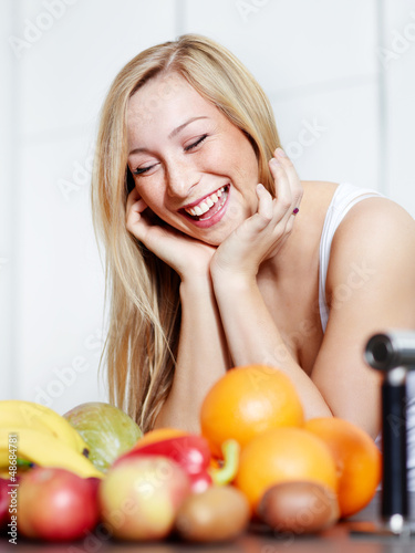 Photo: Pretty girl in the kitchen loves healthy food to lose weight Pretty girl in the kitchen loves healthy food to lose weight