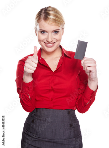Photo: Businesswoman holding credit card. Isolated on white Businesswoman holding credit card. Isolated on white