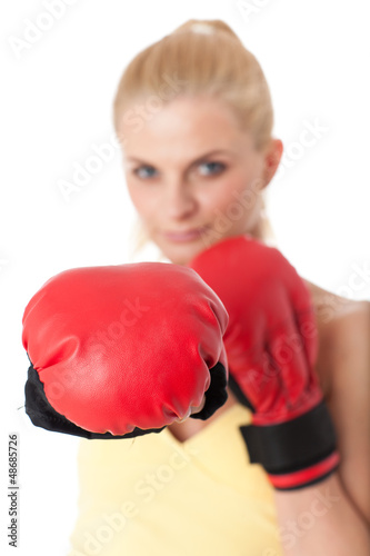 Photo: Young woman in fighting gloves Young woman in fighting gloves
