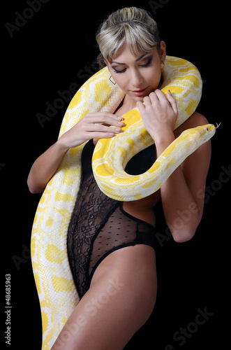 Photo: The beautiful woman with the big yellow snake The beautiful woman with the big yellow snake