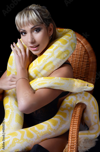 Photo: The beautiful woman with the big yellow snake The beautiful woman with the big yellow snake