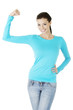 Young woman shows her biceps.