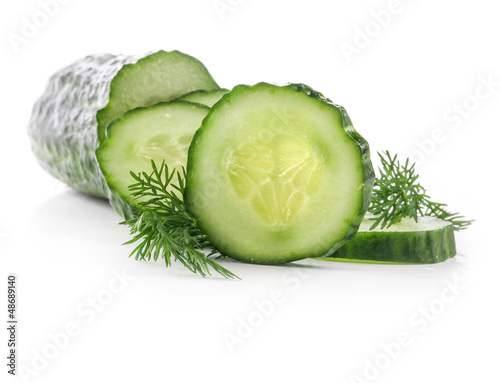 Photo: Cucumber slices and dill isolated on white background Cucumber slices and dill isolated on white background