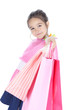 Happy little girl with shopping bags over white