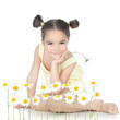 Little girl with daisies on white