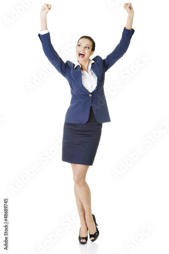 Photo: Young happy businesswoman with hands up Young happy businesswoman with hands up