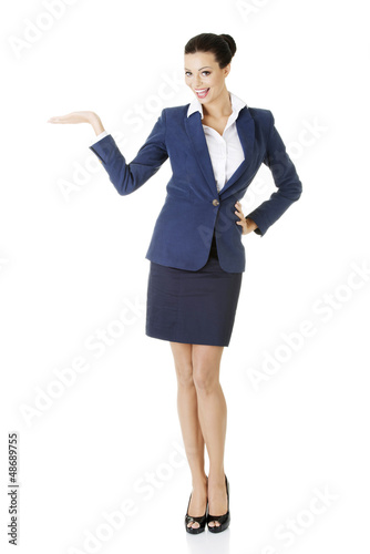Photo: Businesswoman showing copy space on her palm Businesswoman showing copy space on her palm