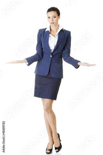 Photo: Businesswoman showing copy space on her palm Businesswoman showing copy space on her palm