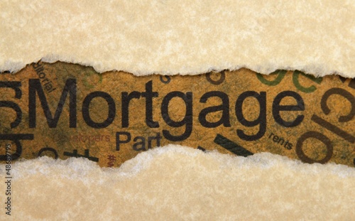 Photo: Mortgage torn paper Mortgage torn paper