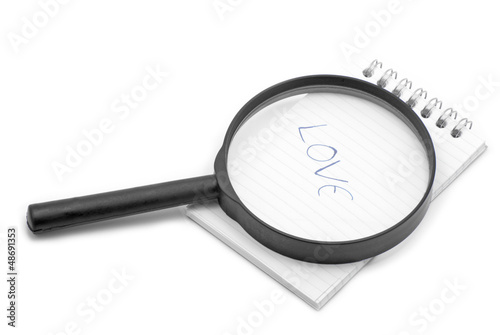 Photo: Notebook and magnifier Notebook and magnifier