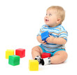 Little boy playing with multicolor blocks