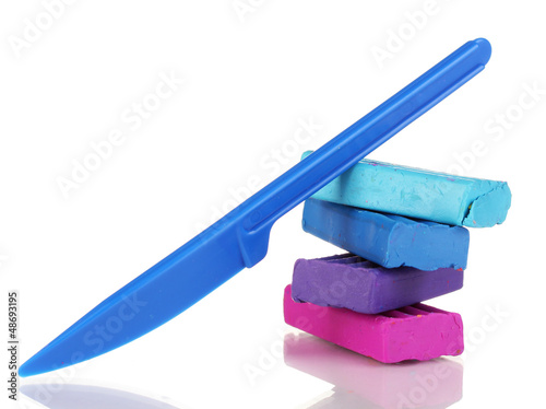 Photo: Children bright plasticine isolated on white Children bright plasticine isolated on white