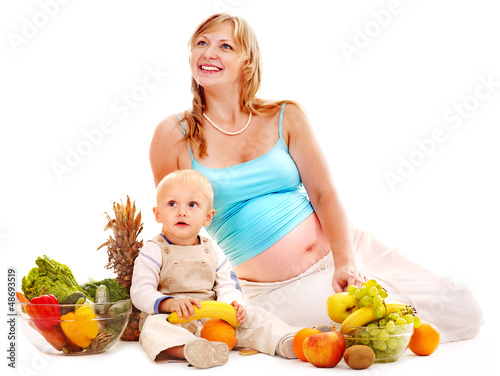 Photo: Family pregnant woman preparing food . Family pregnant woman preparing food .