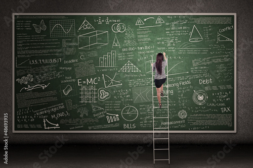 Photo: Hand drawn chalkboard with woman climb Hand drawn chalkboard with woman climb
