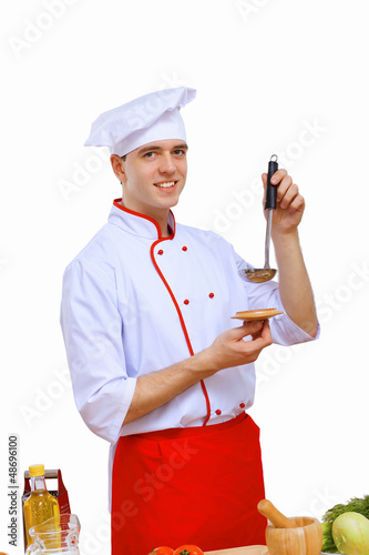 Photo: Young cook preparing food Young cook preparing food
