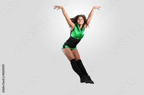 Photo: Young female dancer against white background Young female dancer against white background