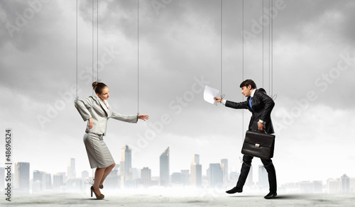 Photo: Puppet businesspeople Puppet businesspeople