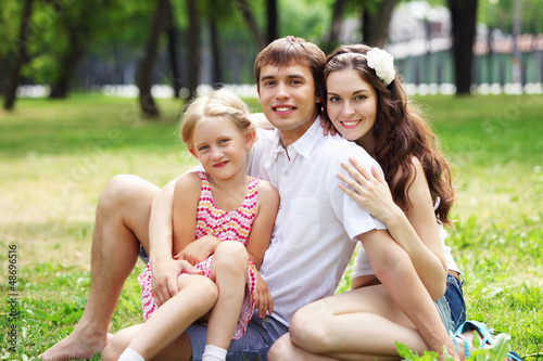 Photo: happy family having fun outdoors happy family having fun outdoors
