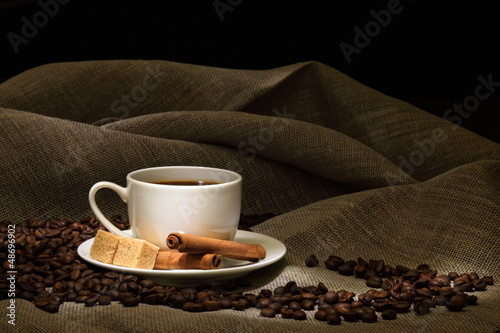 Photo: Coffee beans and white cup Coffee beans and white cup