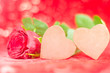 Photo: Two chocolate Hearts with rose in lovely background Two chocolate Hearts with rose in lovely background