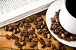 Photo: Coffee cup with fresh coffe beans for breakfast Coffee cup with fresh coffe beans for breakfast
