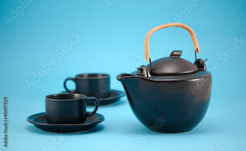 Photo: retro black teapot cups saucers composition blue retro black teapot cups saucers composition blue