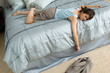 Photo: Business woman collapesed on the bed from exhaustion Business woman collapesed on the bed from exhaustion