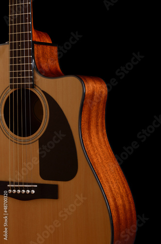 Photo: acoustic guitar on a black background acoustic guitar on a black background