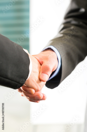 Photo: Business people doing Handshake Business people doing Handshake