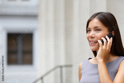 Photo: Woman businesswoman lawyer talking on smart-phone Woman businesswoman lawyer talking on smart-phone