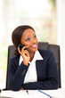 pretty african american office worker talking on cell phone