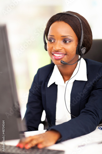 Photo: african american online support operator using computer african american online support operator using computer