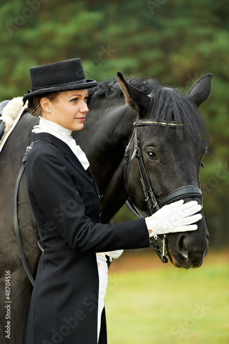 Photo: jockey in uniform with horse jockey in uniform with horse
