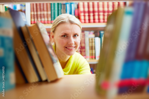 Photo: Peeking out of books Peeking out of books