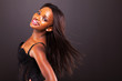 Photo: pretty african american woman with long hair on black background pretty african american woman with long hair on black background